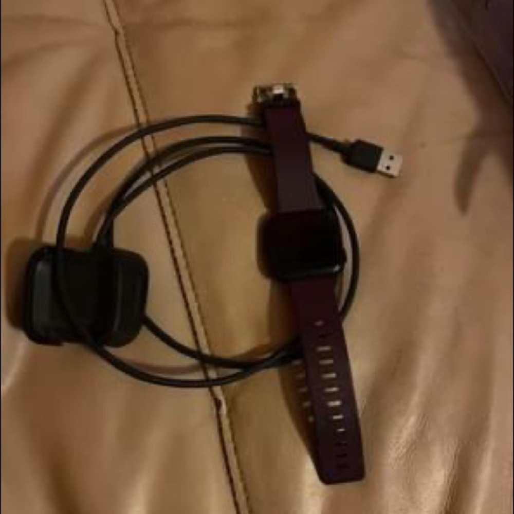 Fitbit versa with charger and a 2nd charger. In good condition.